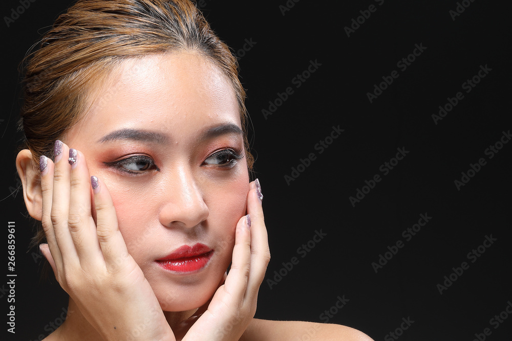 Young beautiful Asian woman makeup dark background Young beautiful Asian woman makeup dark background