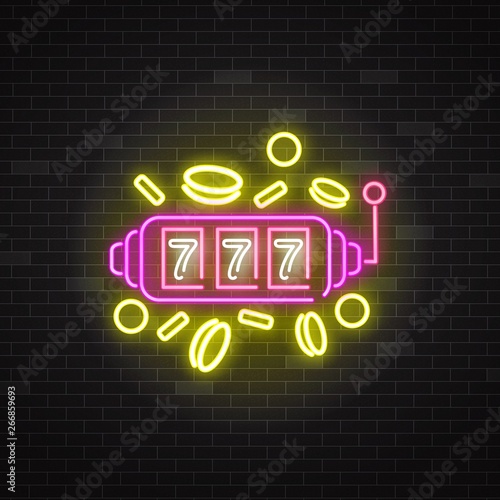 Neon sign of slot machine with lucky sevens jackpot and coins