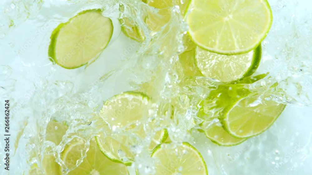 Super Slow Motion Shot of Lime Slices Falling into Water at 1000fps. Super Slow Motion Shot of Lime Slices Falling into Water at 1000fps.