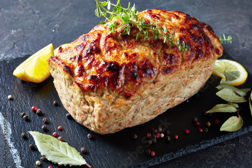 whole chicken meatloaf on a slate tray photo