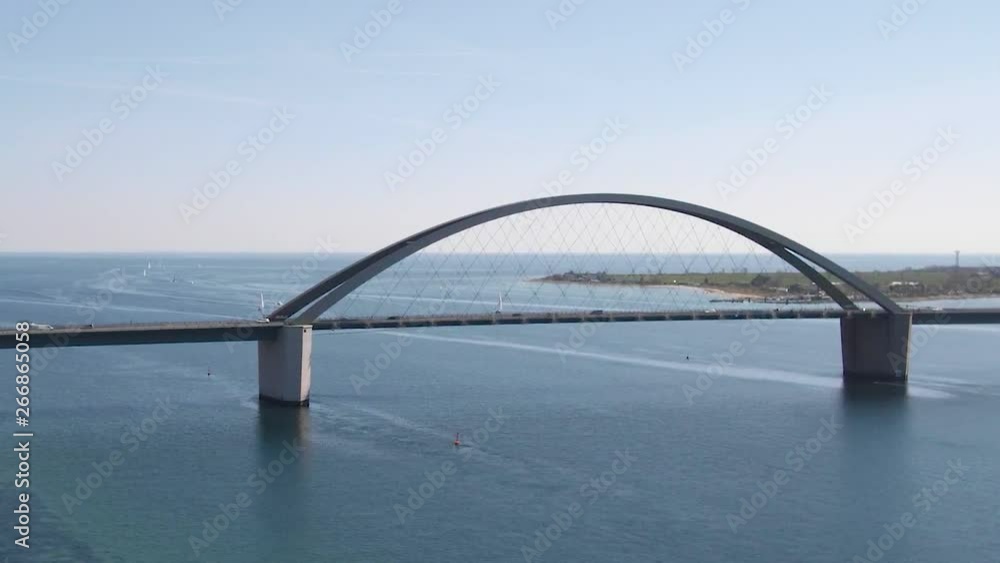 Drone at Fehmarn Bridge and boats, at sunny day, flying straight ahead Drone at Fehmarn Bridge and boats, at sunny day, flying straight ahead