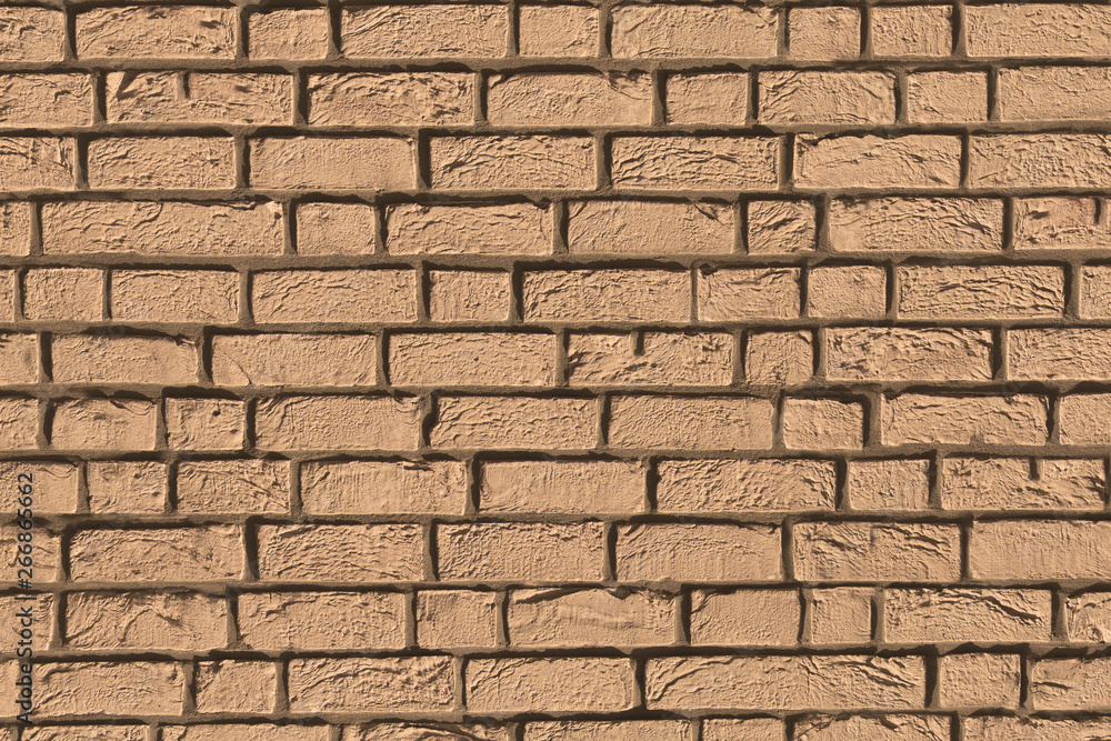 Obraz premium beige light brown brick bricks stone mortar stucco wall background backdrop surface
