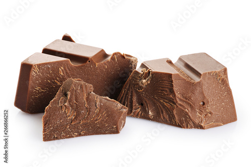 Pieces of milk chocolate isolated on white background.