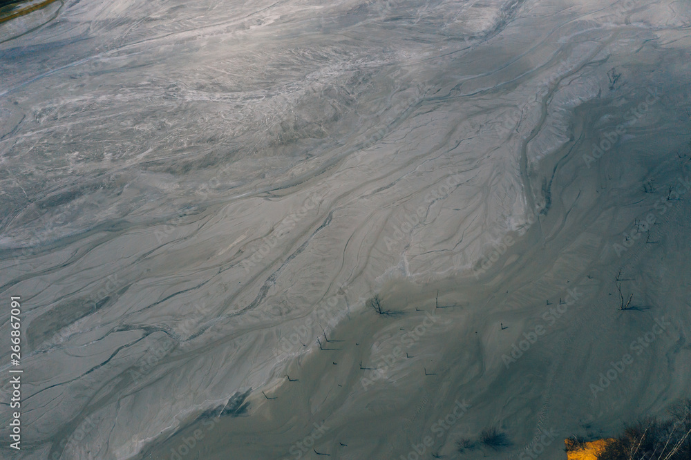 Fototapeta premium Drone view of contaminated, toxic water stream in Geamana, Romania