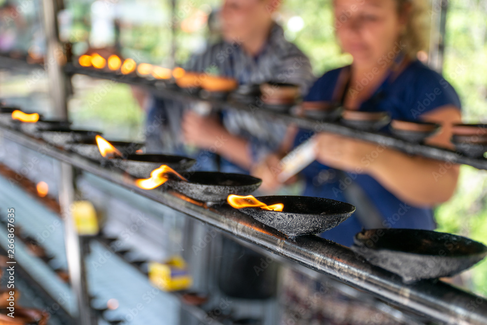 Coconut oil lamps in Sri Dalada Maligawa, Kandy Sri Lanka Coconut oil lamps in Sri Dalada Maligawa, Kandy Sri Lanka