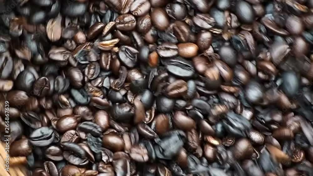 Coffee beans are shakenIn In a bamboo basket Coffee beans are shakenIn In a bamboo basket