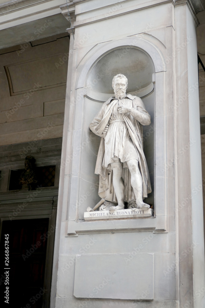 Statue of MICHELANG BUONARROTI  in the niches of the Uffizi Gallery colonnade, Florence.