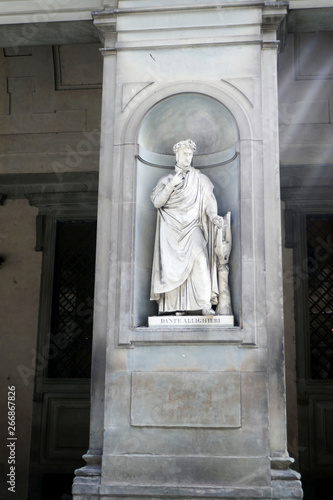Statue of DANTE  ALLIGHIERI  in the niches of the Uffizi Gallery colonnade, Florence. photo