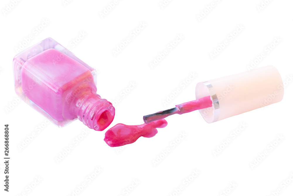 Close up view of a poured out pink nail polish and glass bottle Close up view of a poured out pink nail polish and glass bottle