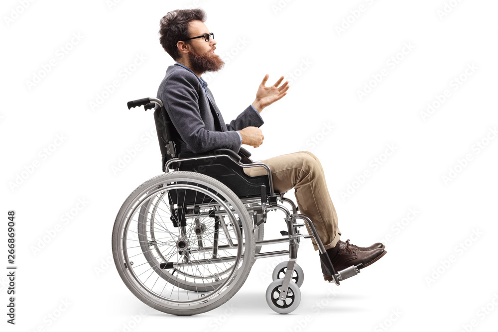 Young man in a wheechair gesturing with hand Young man in a wheechair gesturing with hand