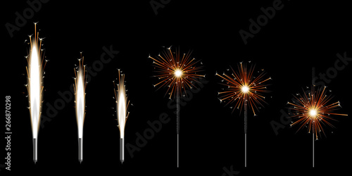 Set of six Bengal sparklers burning with golden shiny star sparkles