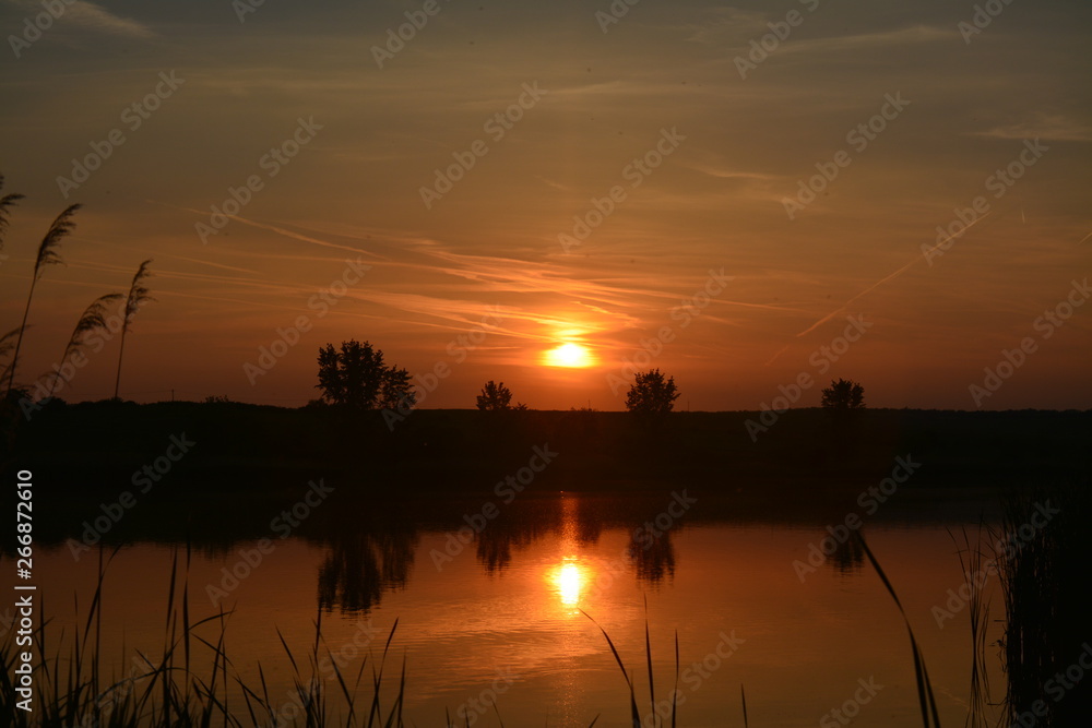 Fototapeta premium a sunset on the lake