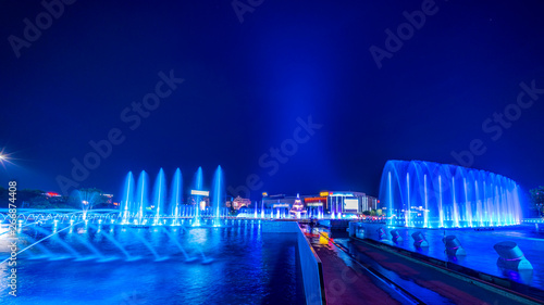 Tableau sur toile Spectacular blue light waterworks in downtown Bucharest wide