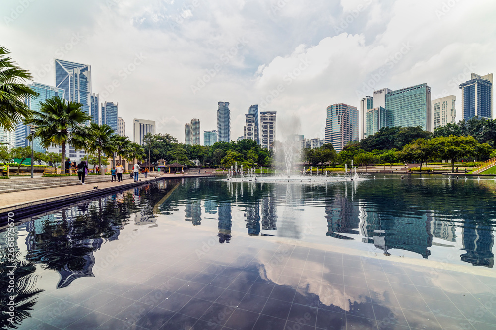 Naklejka premium 22 Apr 2019. Kuala Lumpur, Malaysia. The twin towers of Petronas. Central Park.