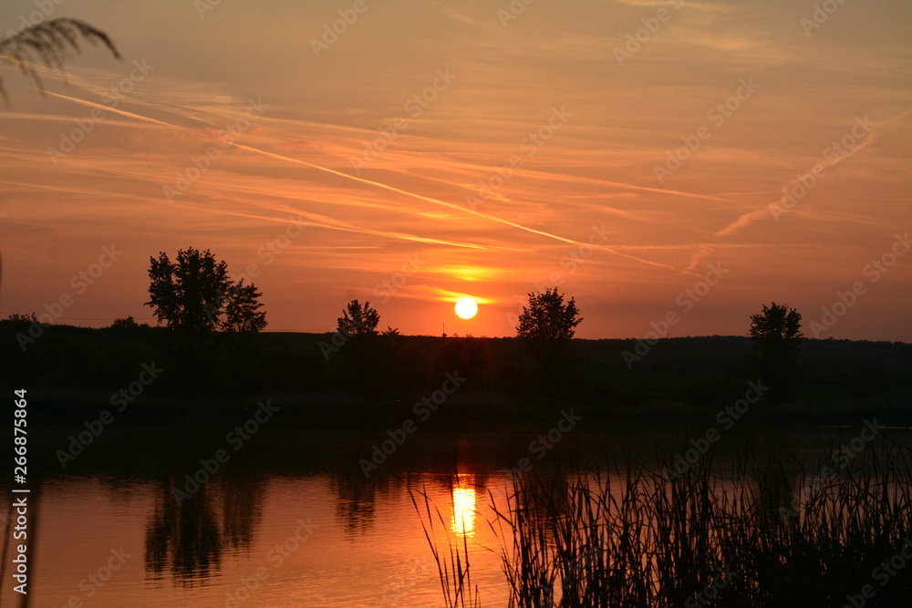 a sunset on the lake