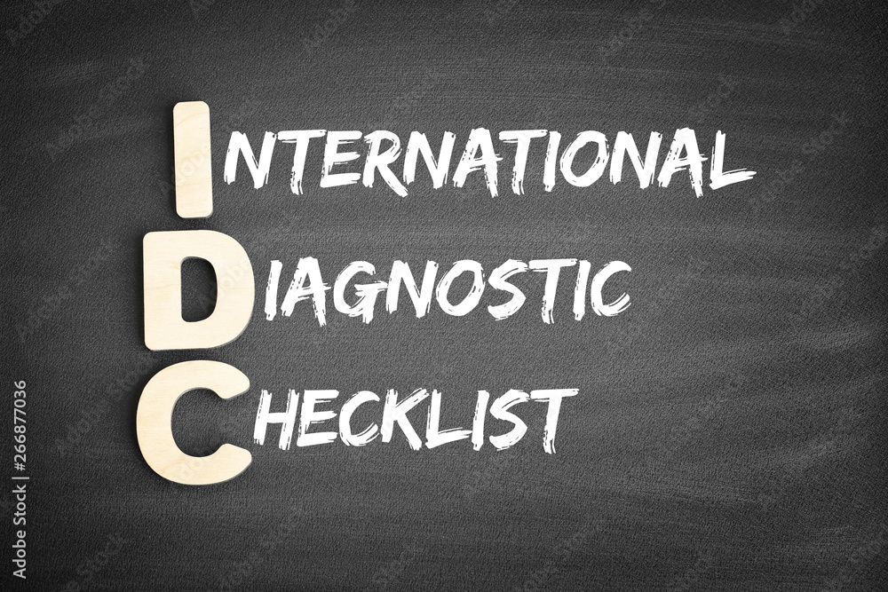 Fototapeta premium Wooden alphabets building the word IDC - International Diagnostic Checklist acronym on blackboard