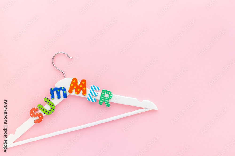 White hangers with summer text pink background White hangers with summer text pink background