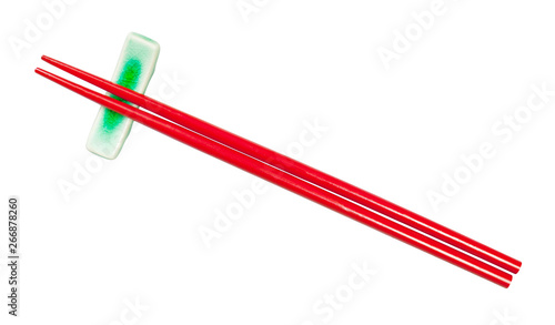 top view of red chopsticks on chopstick rest