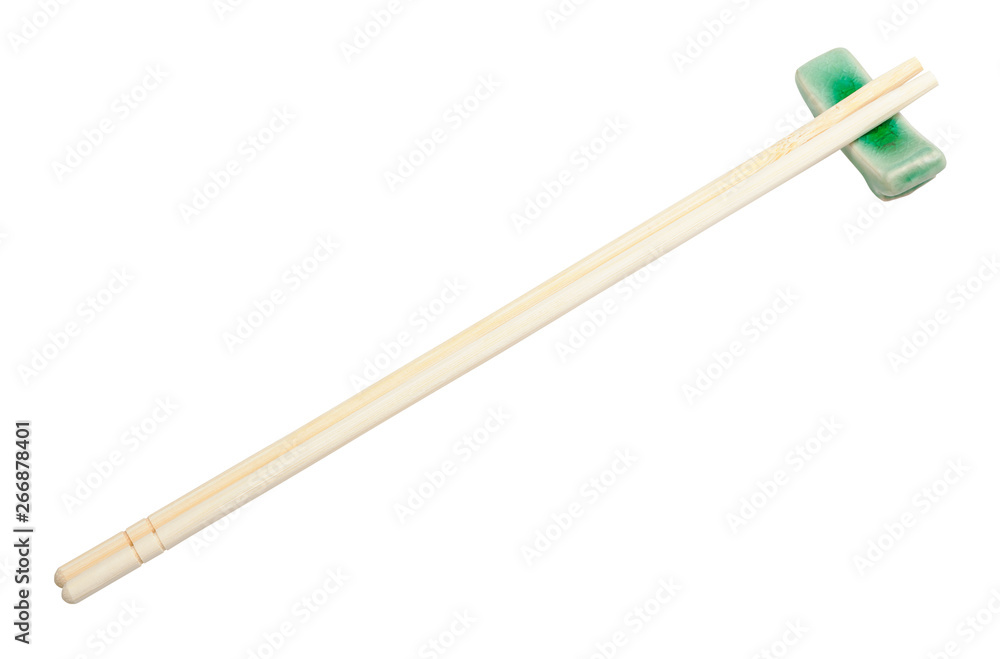 carved disposable chopsticks on rest isolated carved disposable chopsticks on rest isolated