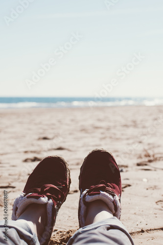 Girl relaxing on sand beach