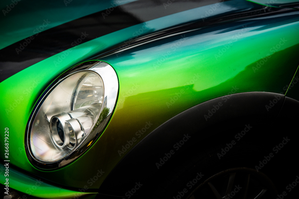 Close-up of multi-color Chameleon paintwork on a modern passenger car.