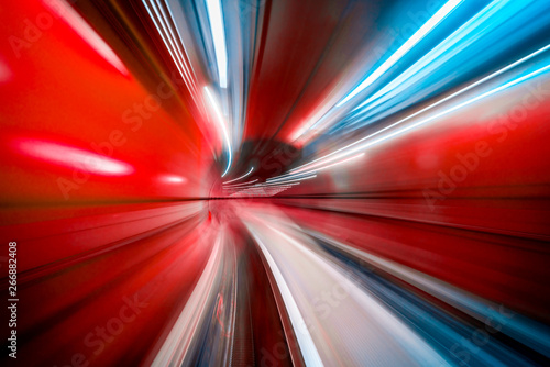 Fotografie, Obraz Abstract colorful concentric light trail accelerating through a tunnel