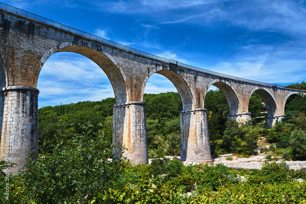 Stone, Railway viaduct over the River Ardeche in France..