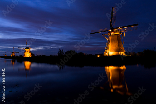 Unesco World Heritage mill in Kinderdijk by night, in spotlight The Netherlands
