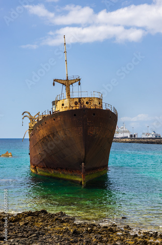 Close up view of ship wreck of Temple Hall with the Port of Arrecife in background © GaiBru Photo