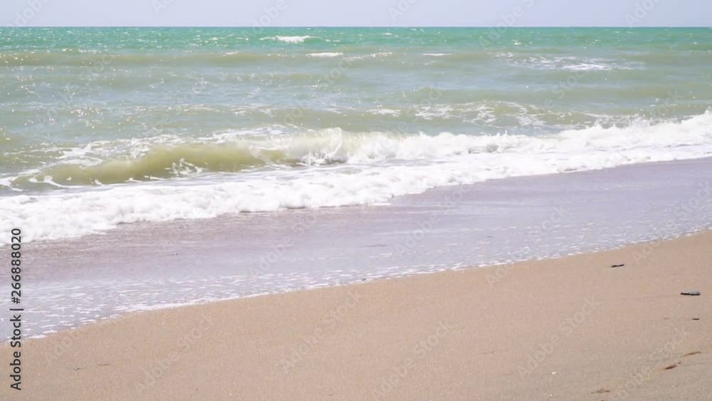 Sea waves, golden sand, beautiful tropical beach without people, slow motion. Sea waves, golden sand, beautiful tropical beach without people, slow motion.