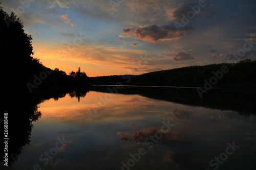 Fototapeta Naklejka Na Ścianę i Meble -  a beautiful sunset on the lake