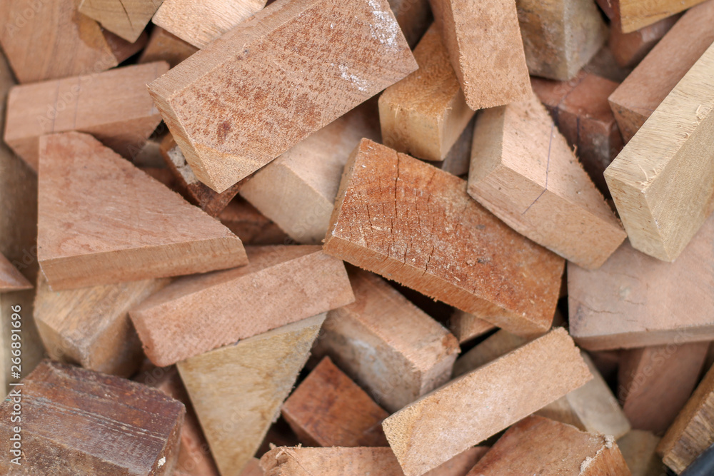 Fototapeta premium sawn wood cut piled perfectly as backround or use to play as toys.