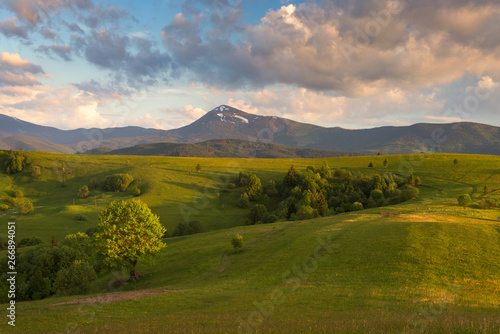 Green spring hills at the foot of the mountain Petros