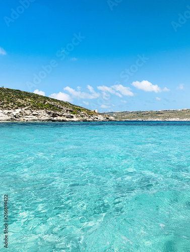 Island with clear blue water. Nature summer seascape in Malta.  Paradise island leisure concept. Travel and tourism. Malta, Comino Island