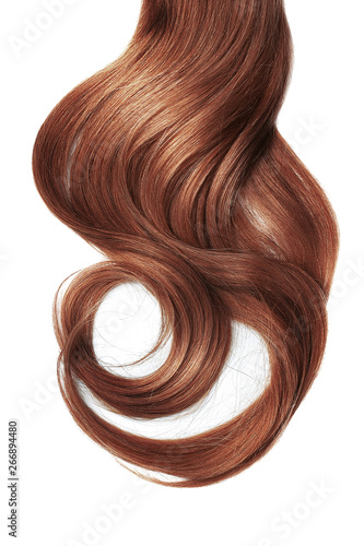 Long wavy henna hair isolated on white background. Ponytail