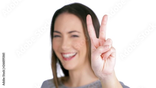 Wallpaper Mural Happy woman gesturing victory or peace isolated on white background Torontodigital.ca