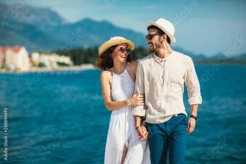 Couple in love, enjoying the summer time by the sea.