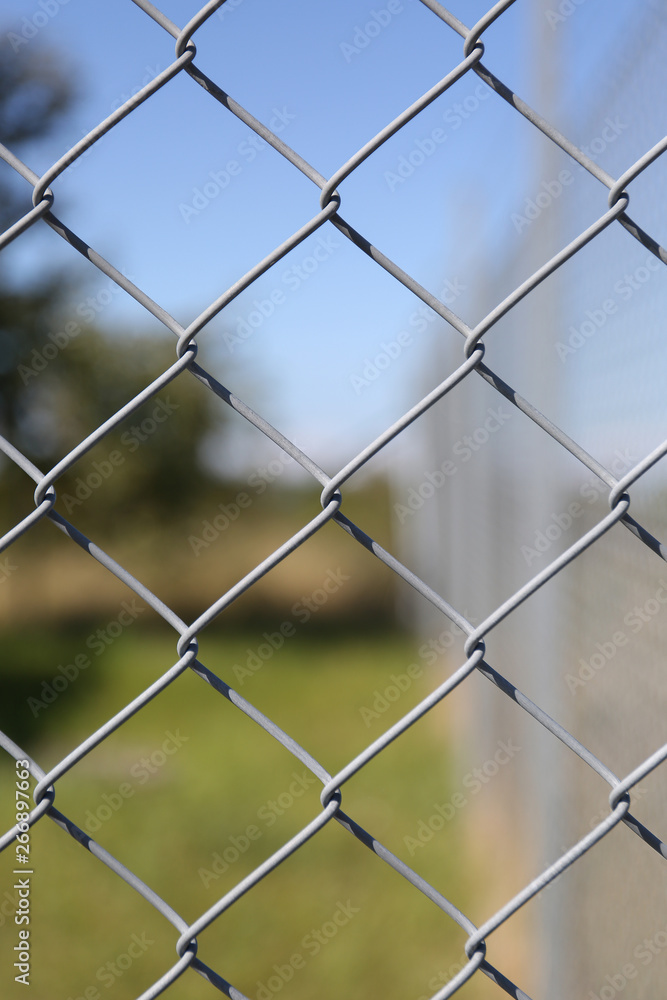 Detail of a fence with abstract background. Detail of a fence with abstract background.