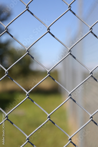 Detail of a fence with abstract background.