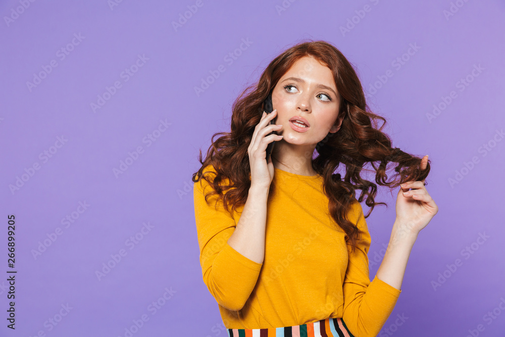 Portrait of a pretty young redheaded woman standing Portrait of a pretty young redheaded woman standing