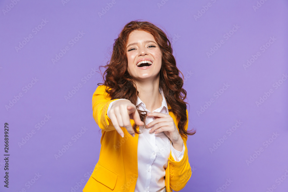 Portrait of a pretty young redheaded woman standing Portrait of a pretty young redheaded woman standing