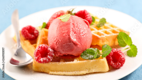 waffles with raspberry and ice cream scoop