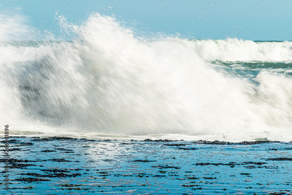 Sea waves hitting on the stones near the coast. White foam comes out of the waves white foam of a sea wave Sea waves hitting on the stones near the coast. White foam comes out of the waves white foam of a sea wave