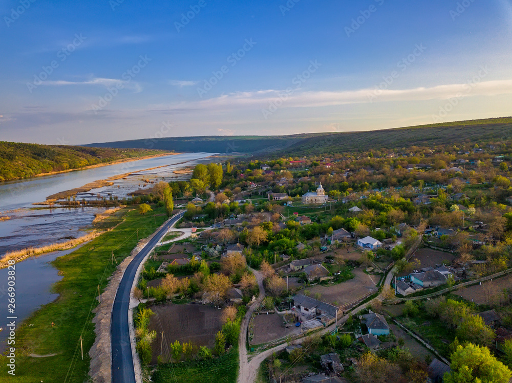 Fototapeta premium Arial view over the river and small village.