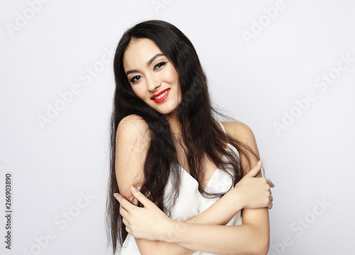 lifestyle and people concept - beautiful young asian woman with long hair posing in casual clothes