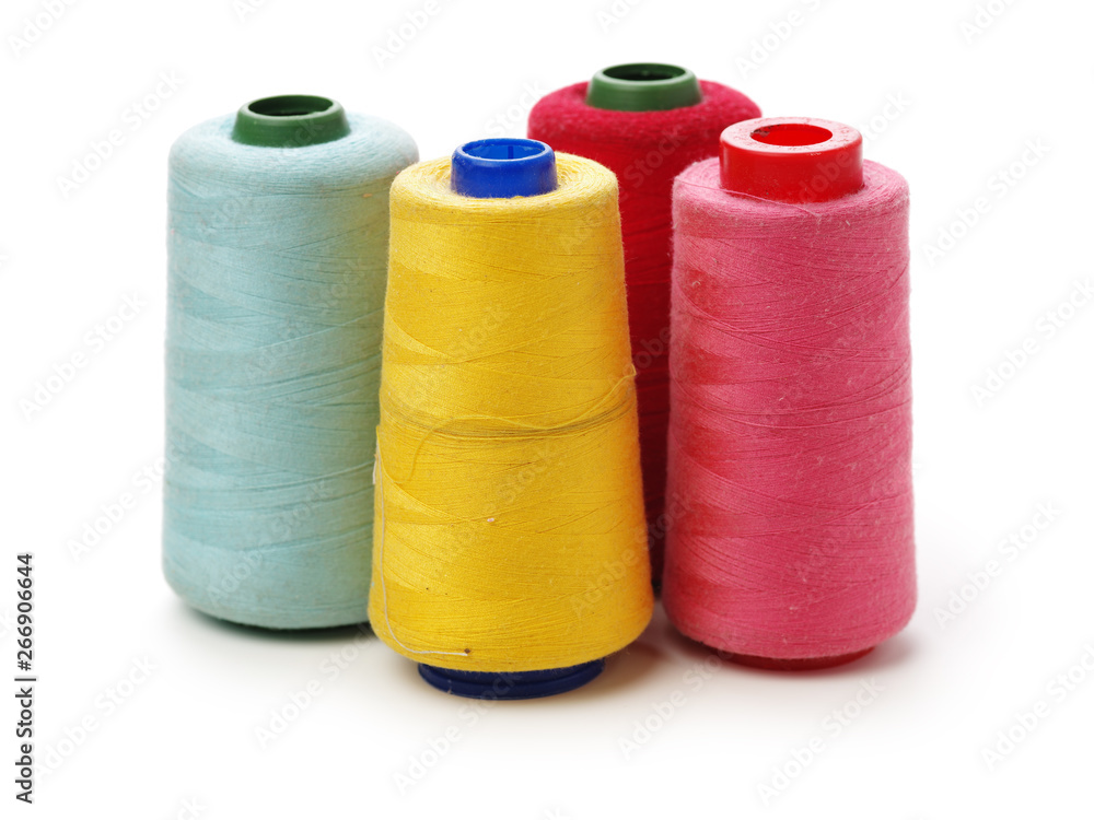 spools of thread for the textile industry on white background spools of thread for the textile industry on white background