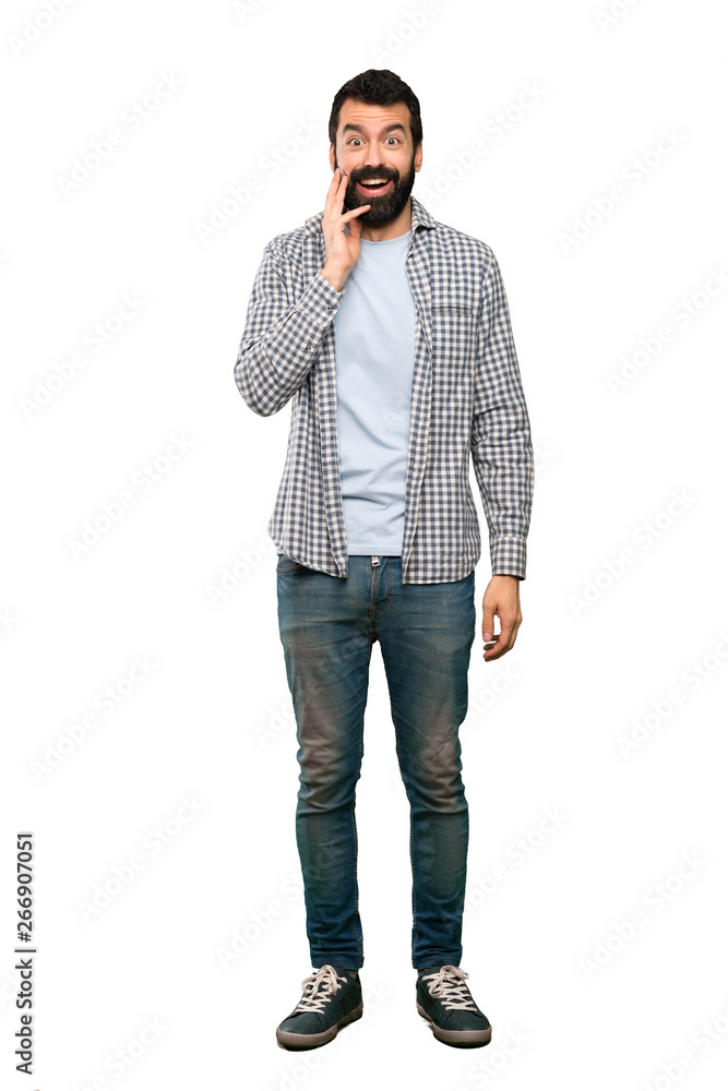Handsome man with beard with surprise and shocked facial expression over isolated white background Handsome man with beard with surprise and shocked facial expression over isolated white background