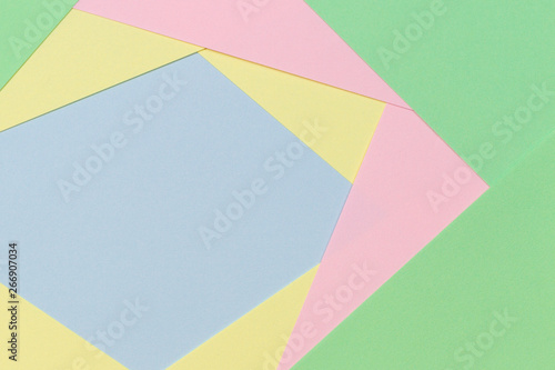 Abstract geometric paper background in light pastel color tones
