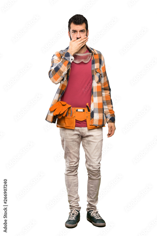 Craftsmen man covering mouth with hands over isolated white background Craftsmen man covering mouth with hands over isolated white background