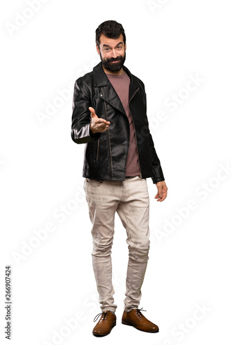 Handsome man with beard shaking hands for closing a good deal over isolated white background